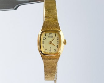 Ladies' Gold-Tone Citizen Quartz Watch with Integrated Bracelet