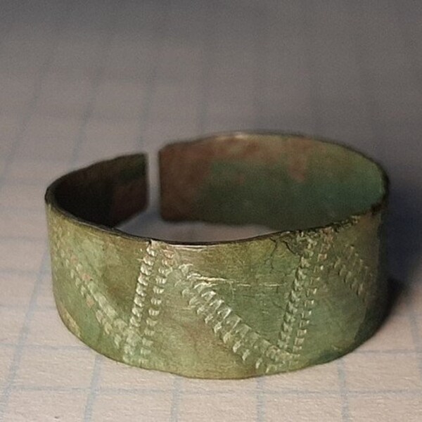 Plate RING with a pattern. Ancient Scythian bronze bracelet. Scythian bronze. Artifact of the 4th-6th century BC.