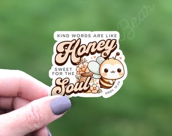 May include: A sticker with a cute cartoon bee and a jar of honey. The text reads "Kind words are like honey, sweet for the soul, Prov. 16:24".