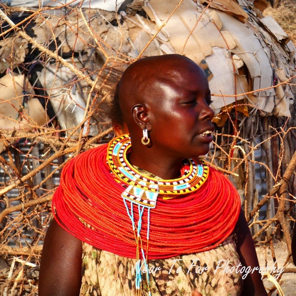 Portrait of native African, with colorful handmade jewelry, museum quality photo, Masai Mara in Kenya Africa