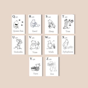 May include: Nine black and white illustrated cards featuring Winnie the Pooh characters and objects, each representing a letter of the alphabet from Q to Z. The cards include words like "Queen Bee," "Read," and "Zoo."