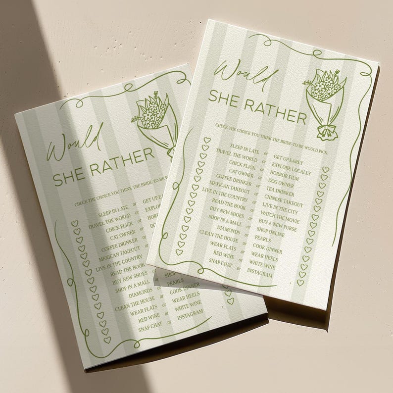May include: Two light green "Would She Rather" game cards with a floral illustration and text. The cards have a striped background and a decorative border of hearts. The text includes various choices.