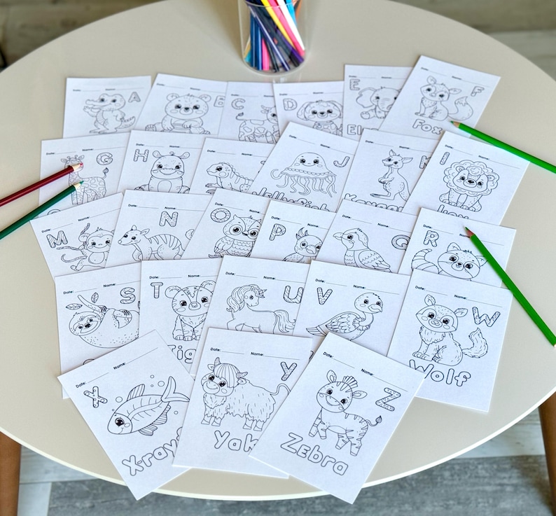 May include: Black and white coloring pages featuring animals and letters of the alphabet. Each page has a different animal and letter, such as a fox for F, a wolf for W, and a yak for Y.