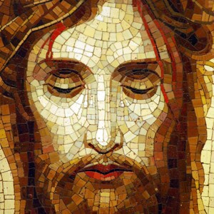 May include: A mosaic portrait of a person with closed eyes, a beard, and long hair. The artwork uses a variety of brown, tan, and red tiles to create the image. Red lines are visible on the forehead. The mosaic is a close-up of the face.