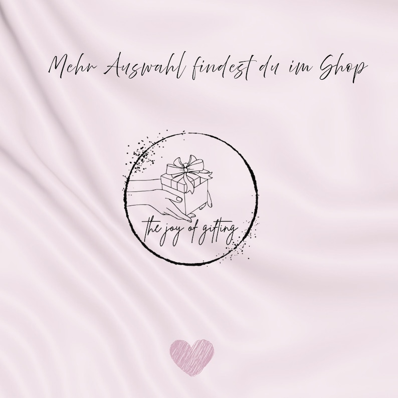 May include: A light pink background with a heart at the bottom and text at the top. A black circular logo features a hand holding a gift box with a bow, and the words "the joy of gifting."