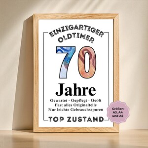 May include: A framed print with the text "EINZIGARTIGER OLDTIMER 70 Jahre" in black. The number 70 is filled with images of currency. The print also includes the phrases "TOP ZUSTAND" and "Gr&ouml;&szlig;en: A3, A4 und A5".