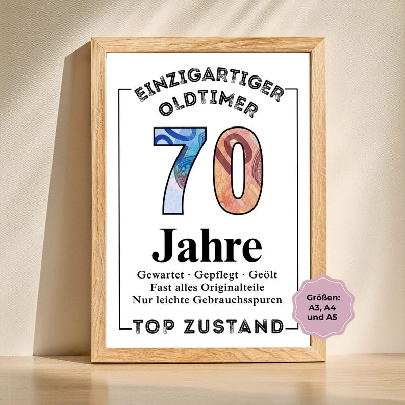 May include: A framed print with the text "EINZIGARTIGER OLDTIMER 70 Jahre" in black. The number 70 is filled with images of currency. The print also includes the phrases "TOP ZUSTAND" and "Gr&ouml;&szlig;en: A3, A4 und A5".