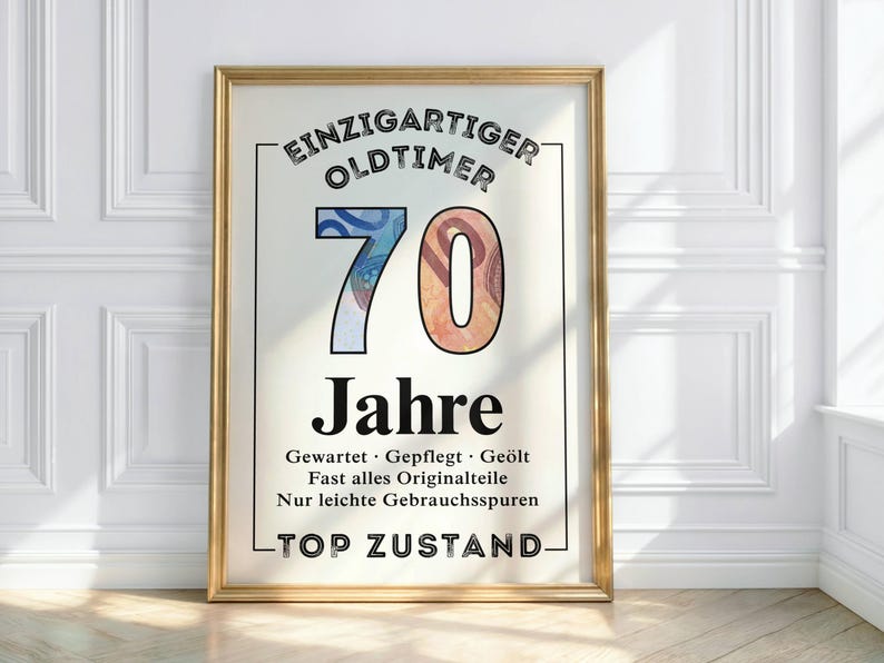 May include: A framed print with gold trim, featuring the words "EINZIGARTIGER OLDTIMER 70 Jahre" in black font. The number 70 is filled with colorful currency designs. Additional text includes "Gewartet, Gepflegt, Ge&ouml;lt" and "TOP ZUSTAND."