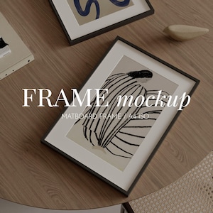 May include: A black frame mockup with a white mount board and a black and white illustration of a person inside. The text "FRAME mockup" is written in white letters on a black background. The text "MATBOARD FRAME | A4 ISO" is written in white letters on a black background.