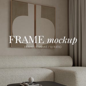 May include: Two framed canvas art pieces with abstract designs in beige and brown tones hang above a cream-colored sofa. The text "FRAME mockup" is displayed on the image, along with "FRAMED CANVAS / 1:2 RATIO".