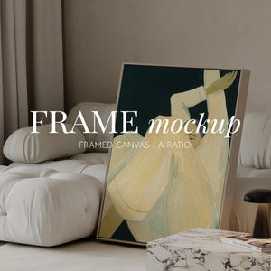 May include: A framed canvas print featuring an abstract illustration of a figure in light yellow clothing against a dark green background. The text "FRAME mockup" and "FRAMED CANVAS / A RATIO" is overlaid on the artwork in white lettering.