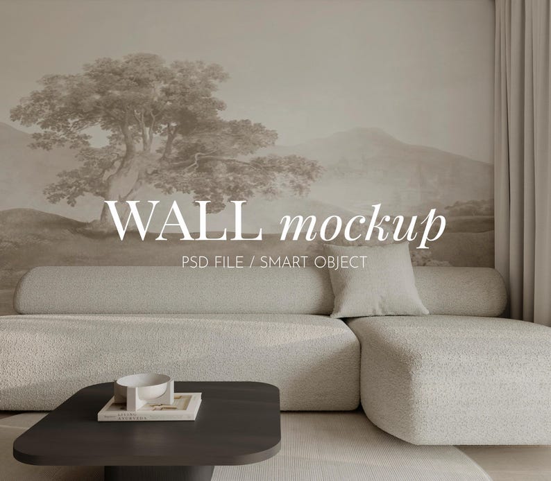 May include: A mockup of a wall with a neutral beige background featuring a landscape mural with a tree and mountains. The wall is decorated with a white couch and a coffee table. The text "WALL mockup" and "PSD FILE / SMART OBJECT" is displayed on the wall.