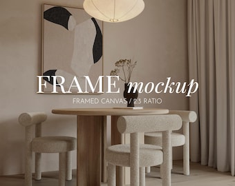 May include: A framed abstract art print with black and white shapes on a beige background hangs on a wall in a living room. The room features a wooden table with four chairs, a white lamp, and a beige curtain.