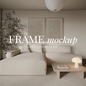 May include: A modern living room scene featuring a beige sectional sofa, a light wood coffee table, and two framed canvases. A small lamp and a book are on the table. The text "FRAME mockup" is displayed on the image.