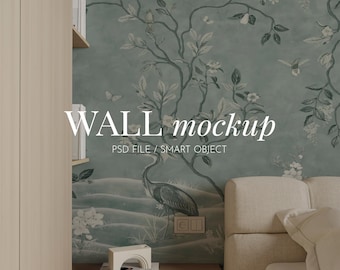 May include: A wall mockup featuring a sage green wallpaper with a dark green heron, floral branches, and butterflies. The text reads WALL mockup PSD FILE / SMART OBJECT. A beige sofa, a white arch sculpture, and a book are positioned in front.