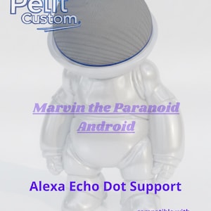 May include: A silver-colored figurine of an astronaut with a mesh helmet, designed to support an Alexa Echo Dot. The text "Marvin the Paranoid Android" and "Alexa Echo Dot Support" are visible. The product is compatible with Alexa, Google, and Apple.
