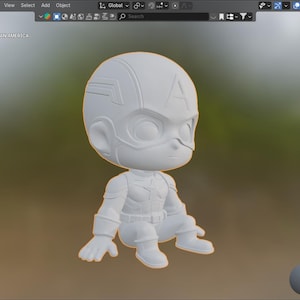 Puede incluir: Figura 3D blanca de Capit&aacute;n Am&eacute;rica en estilo chibi. La figura est&aacute; en posici&oacute;n agachada y presenta el casco, el traje y los detalles del escudo del personaje. El fondo est&aacute; borroso.