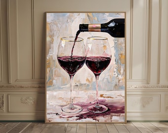 May include: A framed painting depicts two wine glasses with gold rims, filled with red wine. A wine bottle pours wine into one glass. The background has a textured, abstract design with neutral colors. The artwork is displayed in a room with wood flooring.