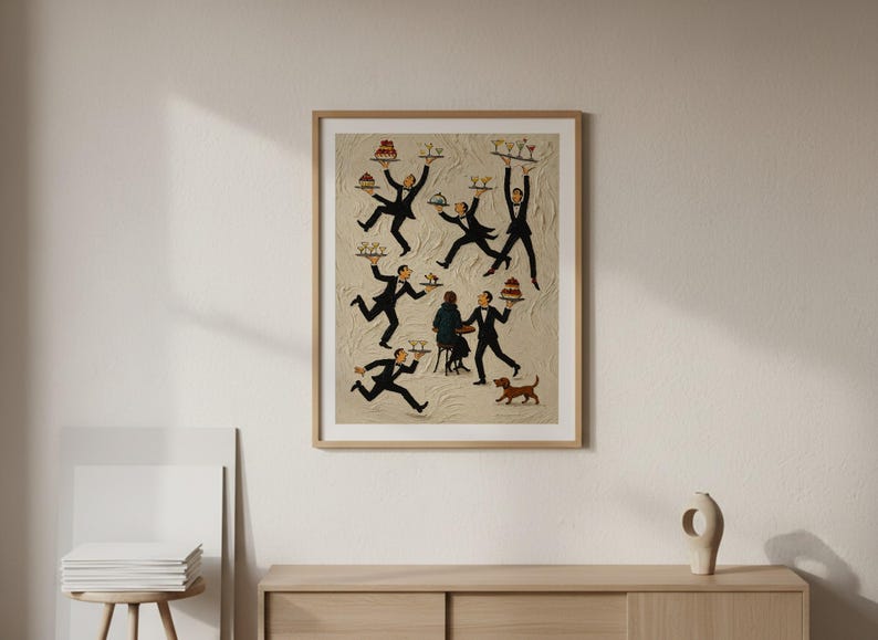May include: A framed wall art print featuring a beige textured background with multiple figures in black tuxedos carrying trays of food and drinks. A seated figure and a small brown dog are also depicted in the center of the composition.