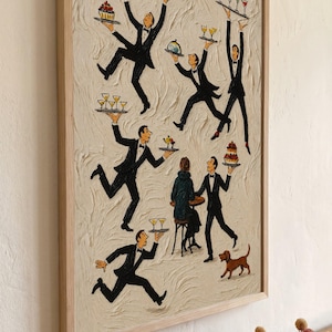 May include: A framed textured painting on a cream background featuring multiple figures in black tuxedos carrying trays with food and drinks. A seated figure at a small table and a small brown dog are also depicted in the scene.