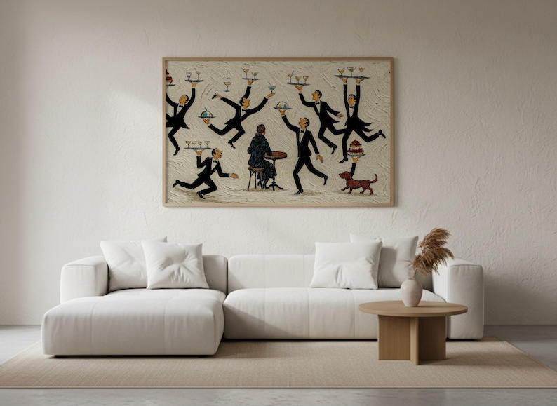 May include: A rectangular wall art print in a light wood frame featuring a stylized illustration of multiple waiters in black suits balancing trays of drinks and food around a seated figure at a small table, with a small brown dog nearby.