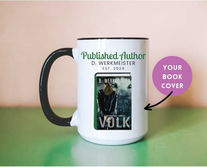 May include: White ceramic mug with a black handle and rim. The mug features a book cover design with the title "VOLK" and the author's name, D. Werkmeister. The mug also has the text "Published Author" and "EST. 2024".