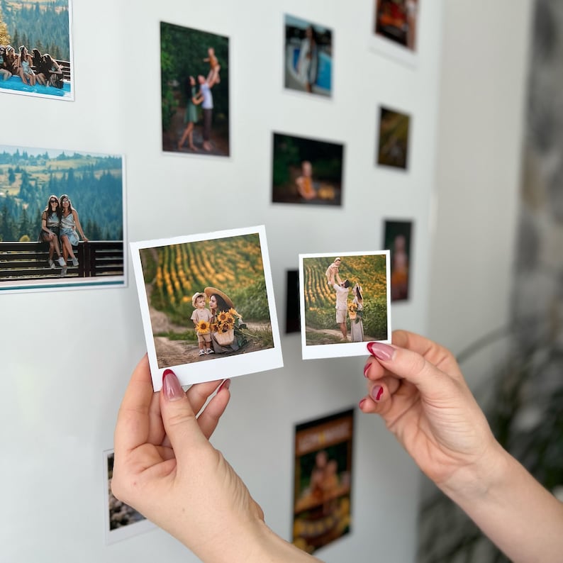May include: Two framed photographs of a family in a field of sunflowers. The photos are in a white frame with a white mat. The photos are hanging on a white wall.