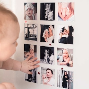May include: A collage of photos featuring a baby in various poses and settings. The photos are arranged in a grid pattern on a white wall. The baby is wearing a variety of outfits, including a white onesie, a blue and white striped shirt, and a white towel. The baby is also seen with a parent in some of the photos.