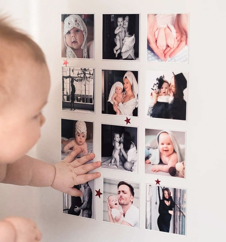May include: A collage of photos featuring a baby in various poses and settings. The photos are arranged in a grid pattern on a white wall. The baby is wearing a variety of outfits, including a white onesie, a blue and white striped shirt, and a white towel. The baby is also seen with a parent in some of the photos.