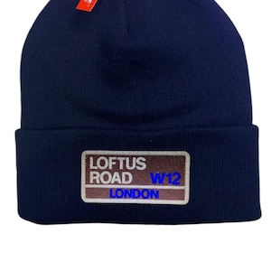 QPR Loftus Road beanie hat. Embroidered in team colours white and Blue. Perfect present for  football fan. Football ground inspired.