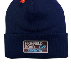 Coventry Highfield Road beanie hat. Embroidered in team colours white and yellow. Perfect present for football fan. Football ground inspired