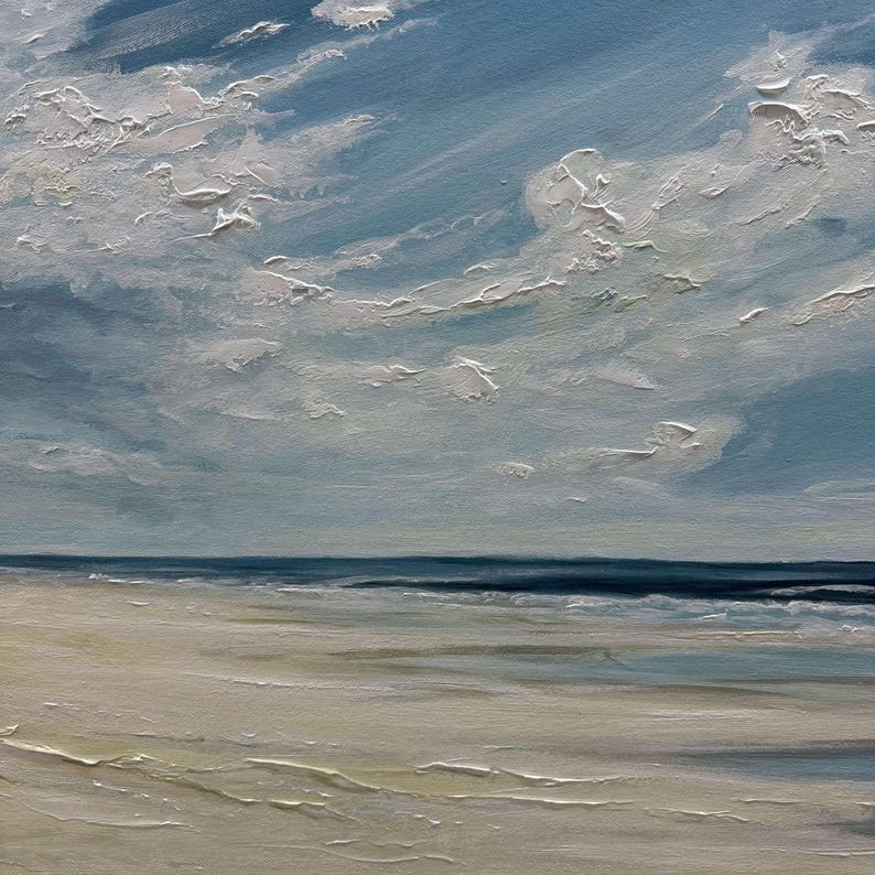 May include: A painting of a beach scene with a blue sky and white clouds. The ocean is a dark blue and the sand is a light beige.