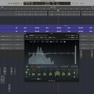 May include: A computer screen displaying audio editing software. The interface shows a waveform, equalizer settings, and various control panels. The software appears to be used for music production or sound design.