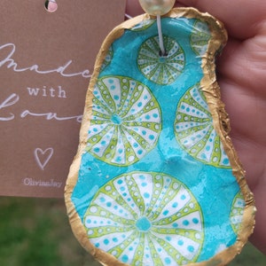 Oyster shell ornament teal shell design anytime ornament strung with two pearls. Beautiful gift.