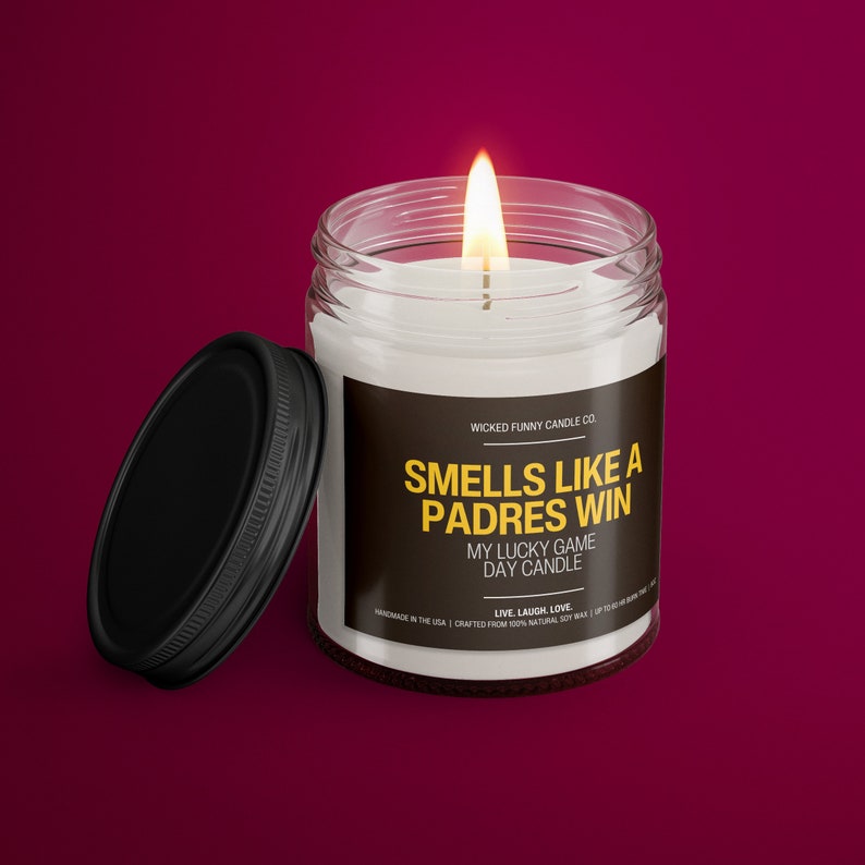 a candle with a lid on a red background