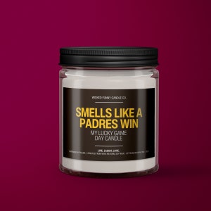 a jar of candles sitting on a red surface