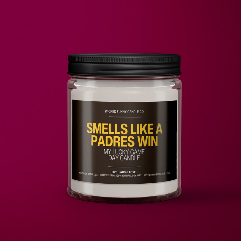 a jar of candles sitting on a red surface