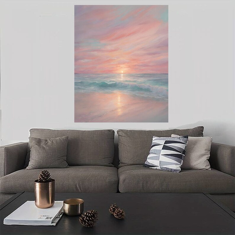 Puede incluir: Una pintura de una puesta de sol rosa y naranja sobre un oc&eacute;ano turquesa con olas blancas rompiendo en la orilla. El sol se pone en la distancia, proyectando un brillo dorado sobre el agua.