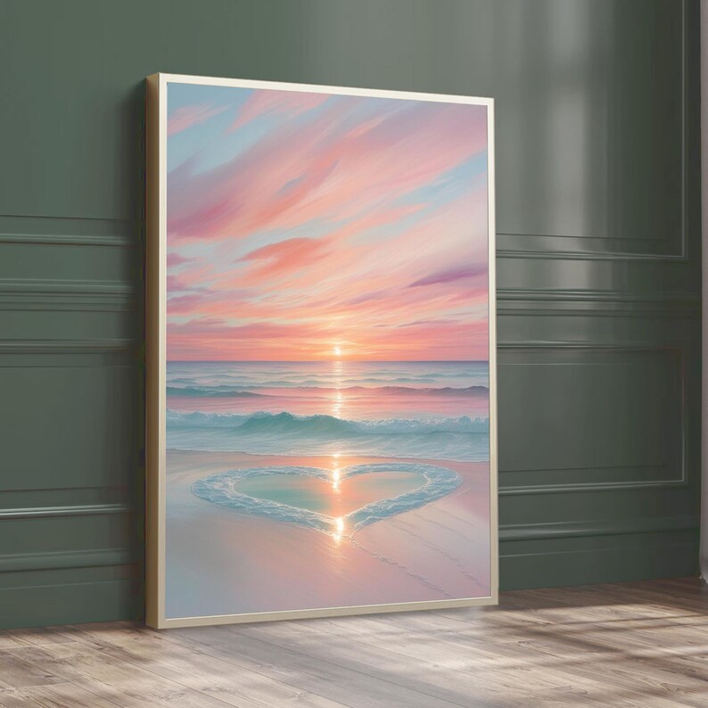 May include: A painting of a pink and blue sunset over a beach with a heart shape drawn in the sand by the waves.