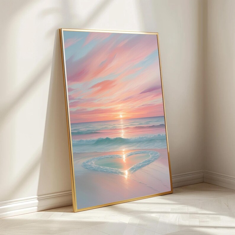 May include: A painting of a pink and blue sunset over a beach with a heart shape formed by the waves in the sand.