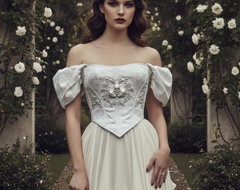 Corsé romántico a medida: corsé blanco barroco con calaveras y mangas abullonadas, estilo nupcial gótico.