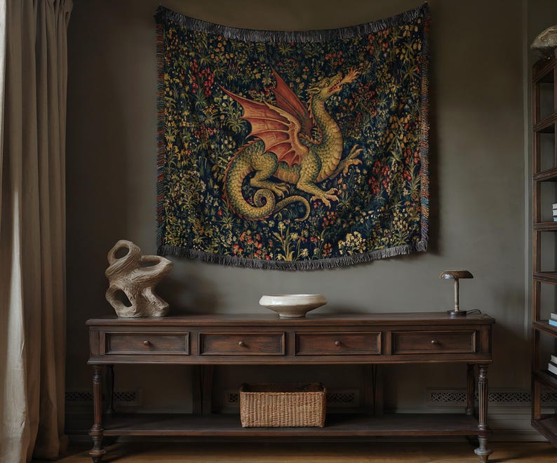 May include: A rectangular woven wall tapestry featuring a large green and red dragon breathing fire, set against a dark blue background filled with intricate floral and botanical patterns, finished with a fringed edge along the bottom border.