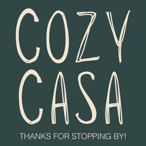 May include: A dark green square graphic featuring the text COZY CASA in a large, hand-drawn, off-white sans-serif font. Below the main text, the phrase THANKS FOR STOPPING BY! is written in a smaller, clean, white, capitalized sans-serif font.