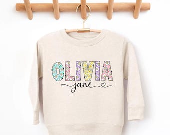 Aangepaste kindernaam met madeliefjes sweater terug naar school shirt, peuter meisje paas lente kleuterschool trui