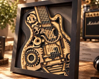 Puede incluir: Un marco negro cuadrado que contiene una pieza de arte mural de madera multicapa con un diseño de guitarra eléctrica estilizada. La obra utiliza capas de madera en contraste, color canela claro y negro, para crear detalles mecánicos.