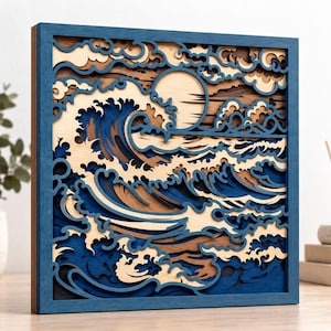 May include: A square multi-layered wooden wall art piece featuring a stylized ocean wave design. The artwork uses shades of blue, natural light wood, and dark brown tones to create depth, depicting crashing waves and a circular sun.
