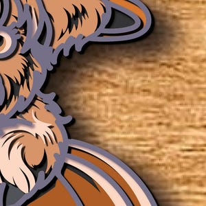 May include: A layered paper art piece depicting a stylised dog's head. The artwork uses shades of brown, tan, and grey, with a detailed design and a shadow effect. The background is a light brown wood grain.