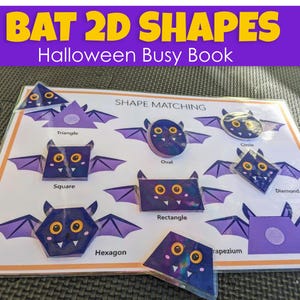 May include: A Halloween-themed busy book with bat-shaped 2D shapes for shape matching. The shapes include triangle, square, oval, rectangle, diamond, and more. The title "BAT 2D SHAPES" is displayed in yellow text on a purple banner. The words "INSTANT DOWNLOAD" are in an orange banner.