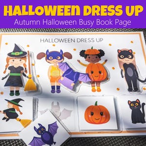 Puede incluir: Una página de libro interactivo con temática de Halloween con el texto "Halloween Dress Up" y "Autumn Halloween Busy Book Page". La página presenta ilustraciones de niños disfrazados de bruja, superhéroe, calabaza y gato, junto con piezas de rompecabezas a juego.