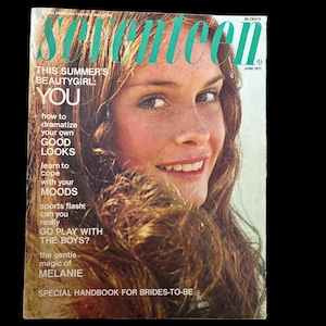 May include: Vintage Seventeen magazine cover featuring a smiling woman with long brown hair. The magazine title is in teal, with text promoting beauty tips and advice. The June 1971 issue is visible.